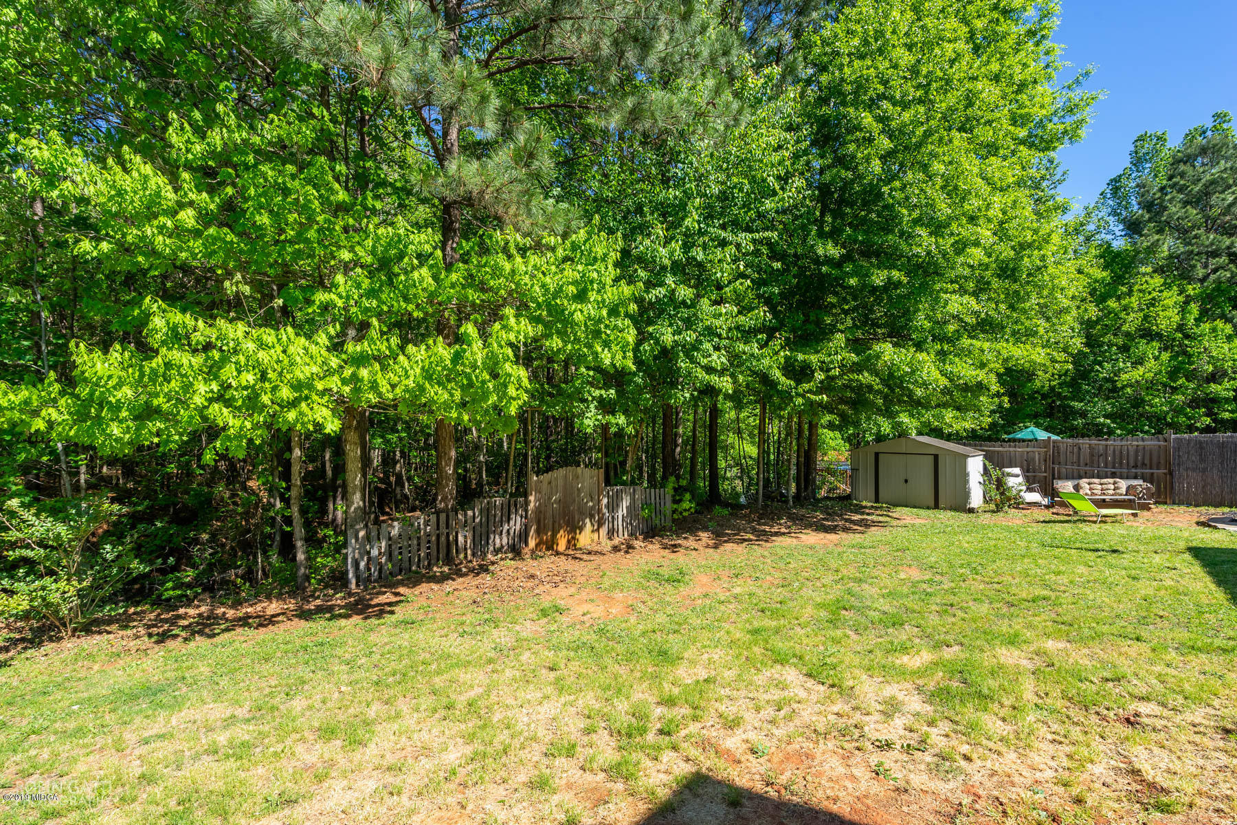 101 Hickory Road Jackson, GA 30233 - Photo 27 of 32 a house with trees in the background