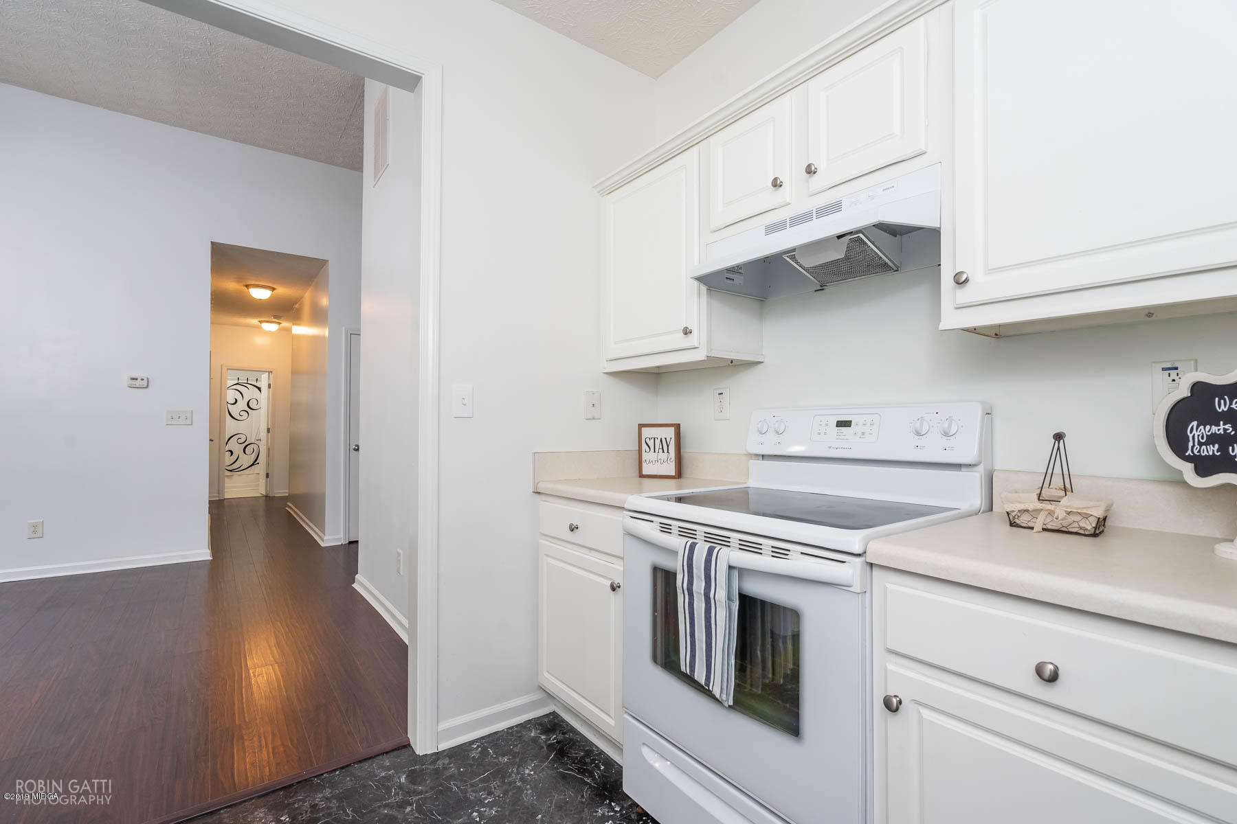 101 Hickory Road Jackson, GA 30233 - Photo 6 of 32 a kitchen with stainless steel appliances white cabinets and a sink