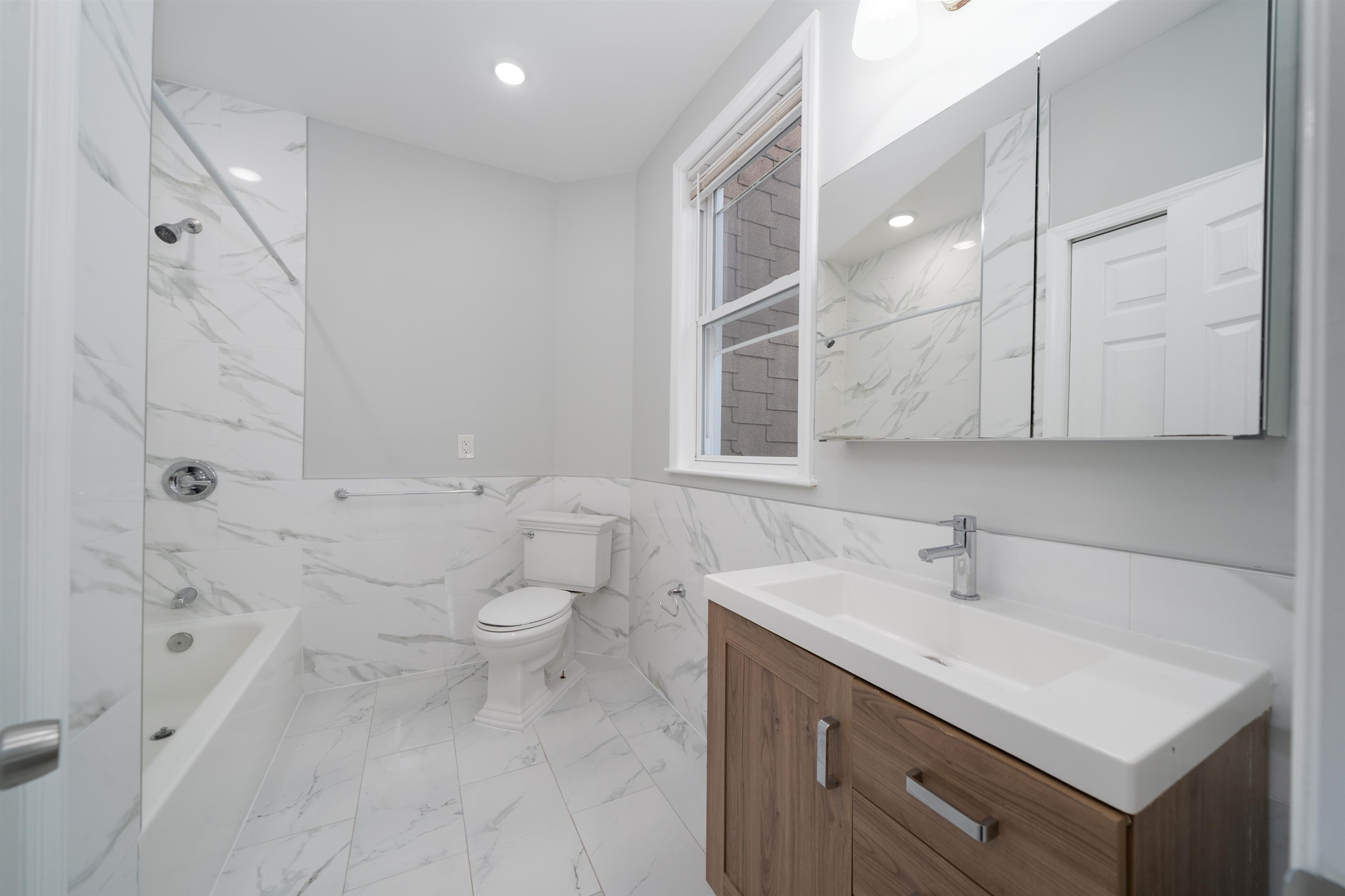 408 Monastery Place, Unit 2 Union City, NJ 07087 - Photo 11 of 21 a bathroom with a sink toilet and shower