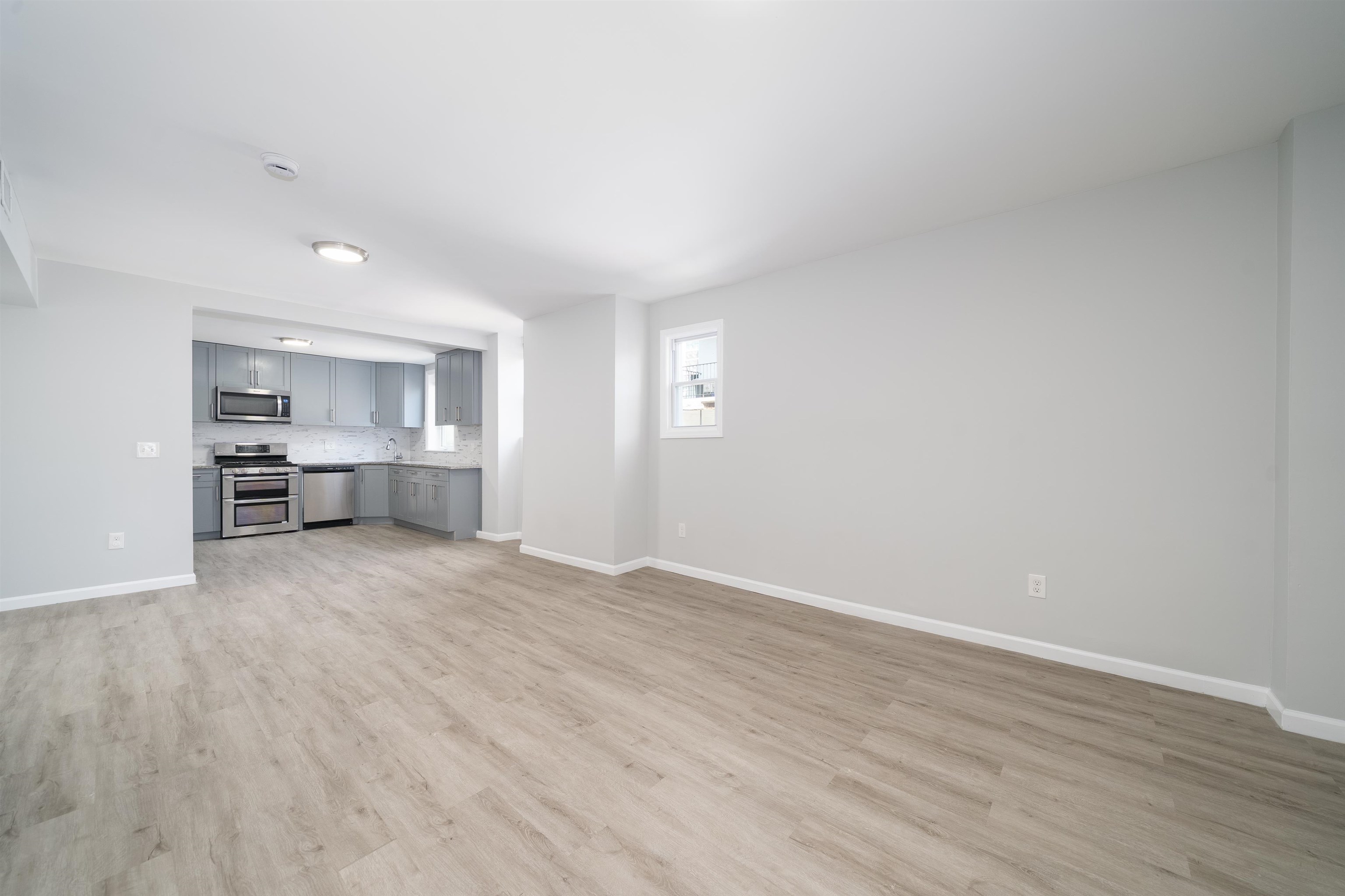 408 Monastery Place, Unit 2 Union City, NJ 07087 - Photo 17 of 21 a view of empty room with wooden floor
