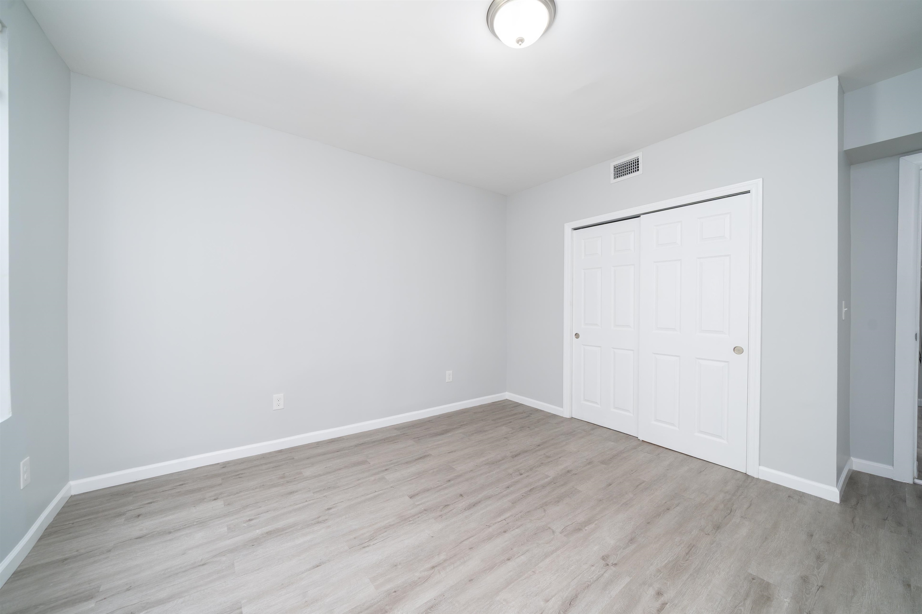 408 Monastery Place, Unit 2 Union City, NJ 07087 - Photo 18 of 21 a view of an empty room with wooden floor