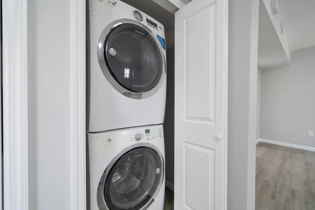a view of a hallway with washer and dryer