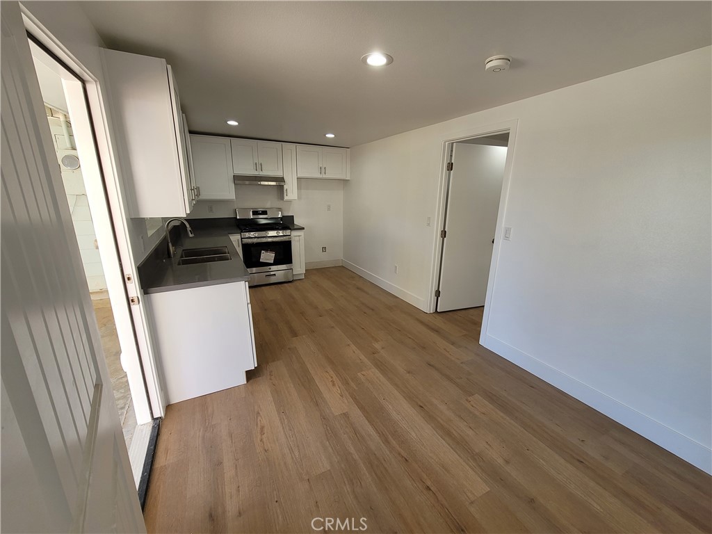 13564 4th Street, Unit 2 Yucaipa, CA 92399 - Photo 3 of 7 a view of kitchen with microwave and refrigerator