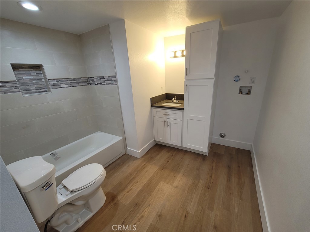 13564 4th Street, Unit 2 Yucaipa, CA 92399 - Photo 7 of 7 a bathroom with a sink a toilet and shower