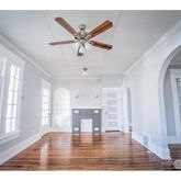 a view interior of livingroom with fireplace and wooden floor