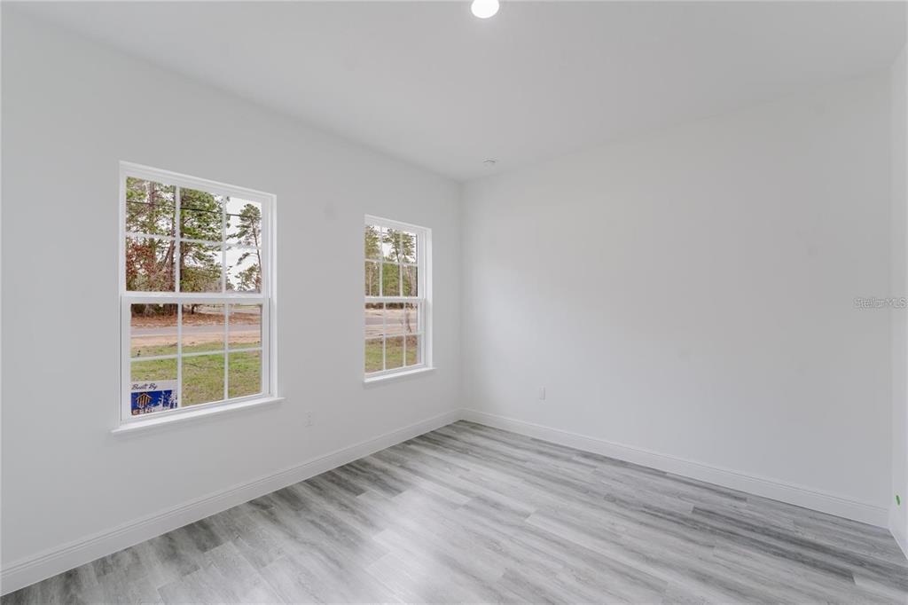 6732 Southwest 132nd Street Ocala, FL 34473 - Photo 17 of 36 an empty room with a window