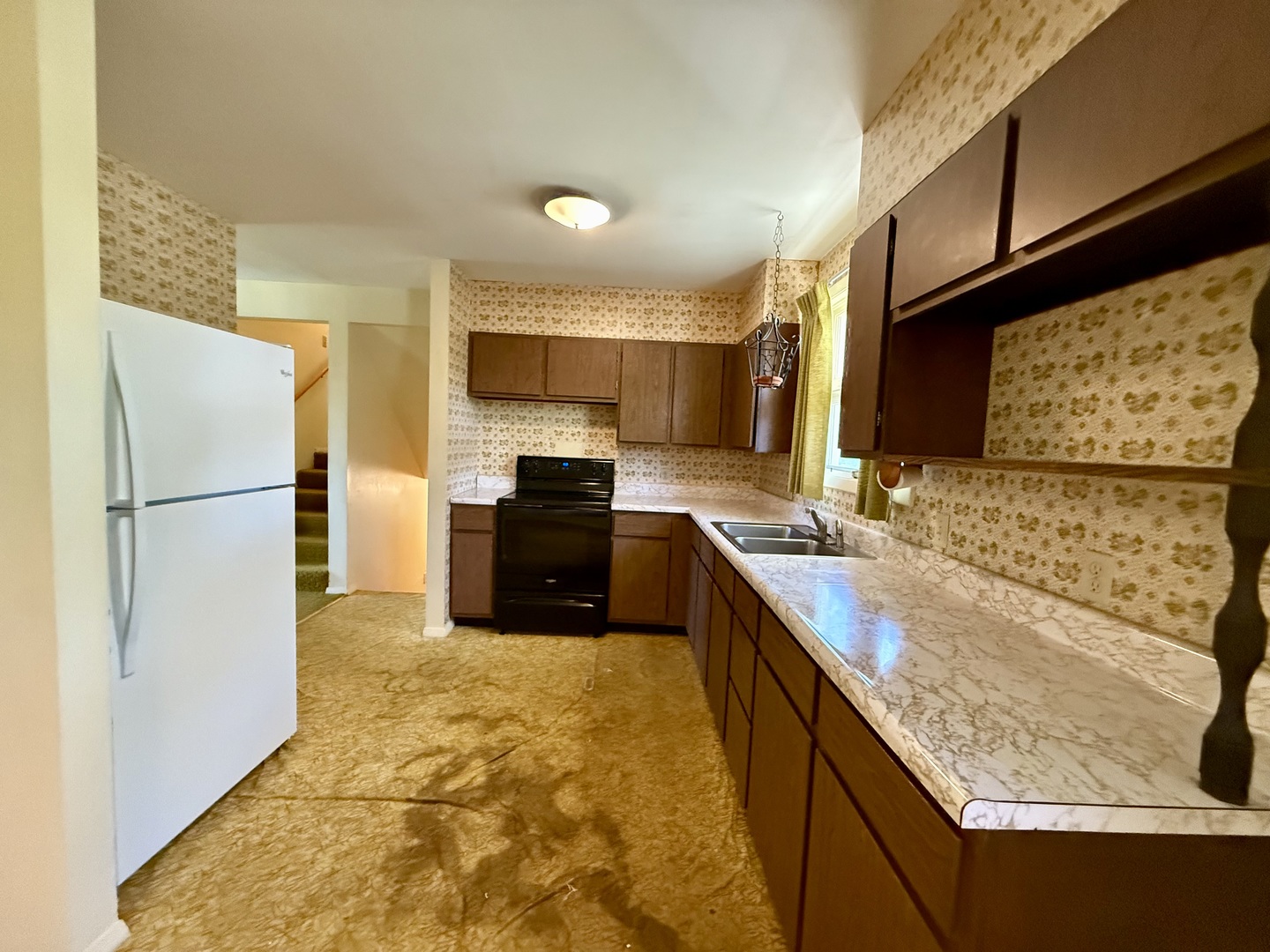 1612 Carolina Drive Rantoul, IL 61866 - Photo 7 of 18 a kitchen with stainless steel appliances granite countertop a refrigerator a stove and a sink