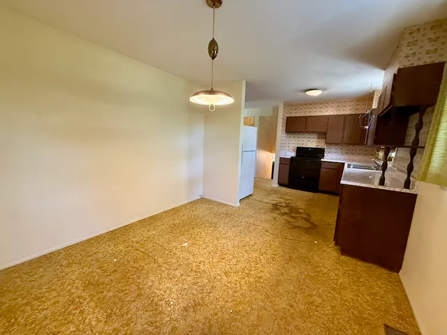 a view of kitchen and dining room with furniture