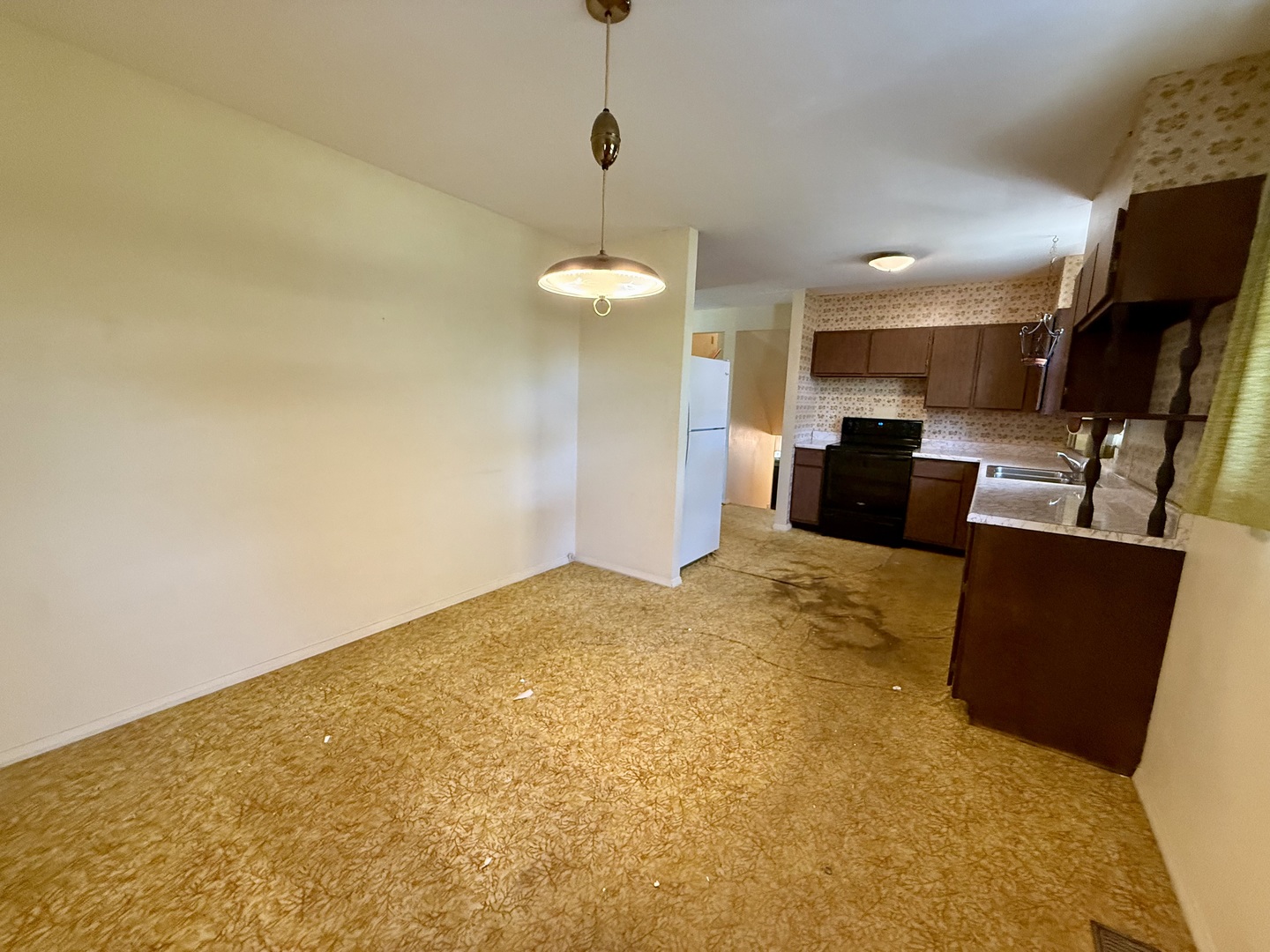 1612 Carolina Drive Rantoul, IL 61866 - Photo 9 of 18 a view of kitchen and dining room with furniture