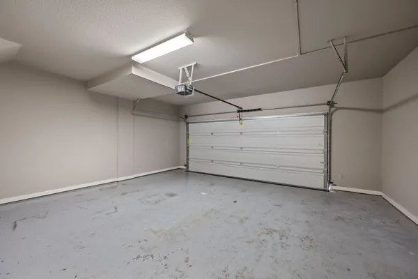 a bathroom with a toilet a sink a mirror and vanity