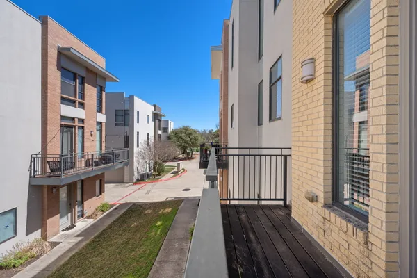 a view of a large building from a balcony