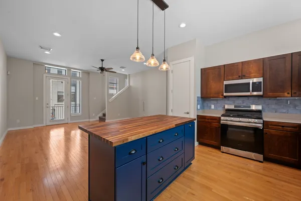 a view of a balcony with wooden floor and fence