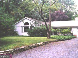360 Jefferson Road Princeton, NJ 08540 - Photo 1 of 4 a front view of a house with a yard and garage
