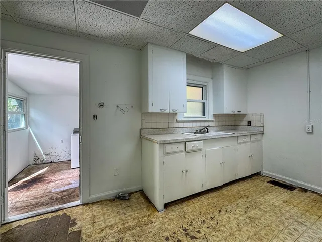 a room with a stove and a window