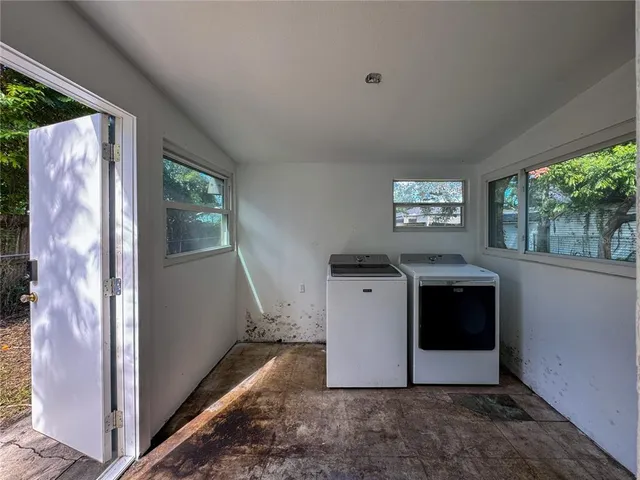 a view of a storage and utility room with a fireplace
