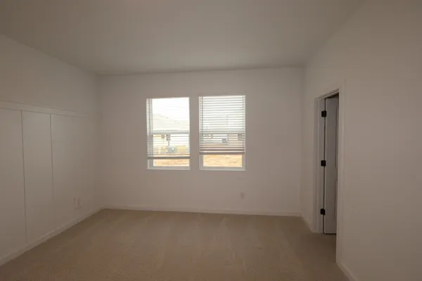 a bathroom with a double vanity sink and mirror