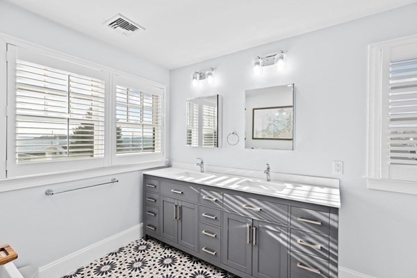 5 Vernon Avenue Hull, MA 02045 - Photo 18 of 33 a bathroom with a granite countertop sink a large window and a shower