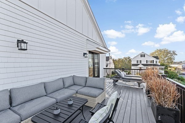 5 Vernon Avenue Hull, MA 02045 - Photo 21 of 33 a balcony with furniture and wooden floor
