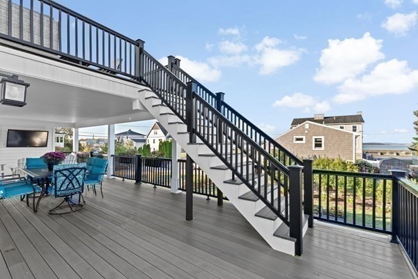 5 Vernon Avenue Hull, MA 02045 - Photo 26 of 33 a view of a balcony with chairs and wooden floor
