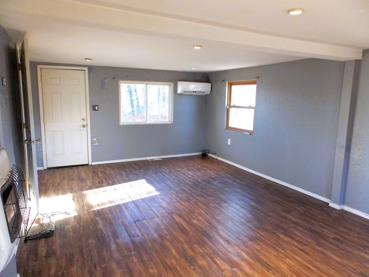 1648 Moonglow Road Centralia, IL 62801 - Photo 11 of 22 an empty room with wooden floor and windows