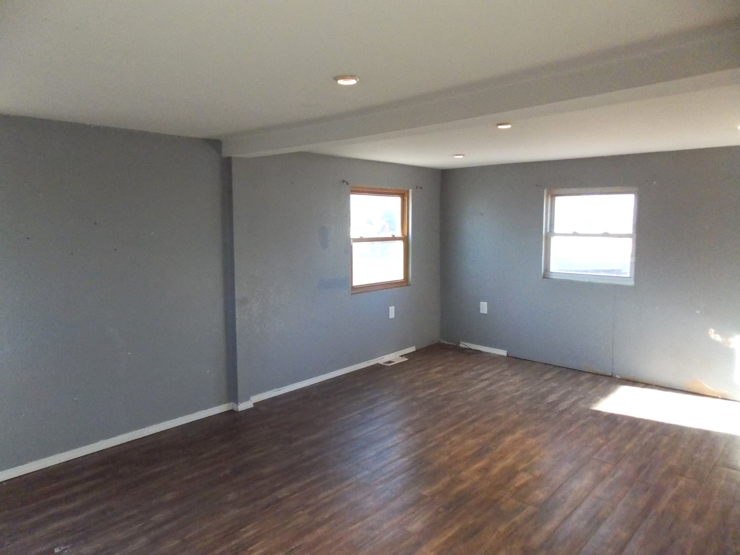 1648 Moonglow Road Centralia, IL 62801 - Photo 12 of 22 an empty room with wooden floor and windows