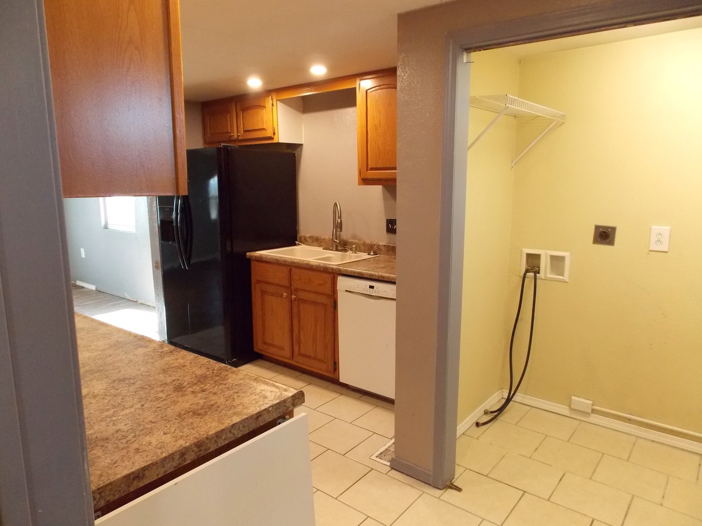 1648 Moonglow Road Centralia, IL 62801 - Photo 9 of 22 a kitchen with stainless steel appliances granite countertop a refrigerator and a sink