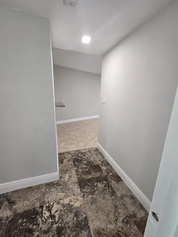 an empty room with a sink