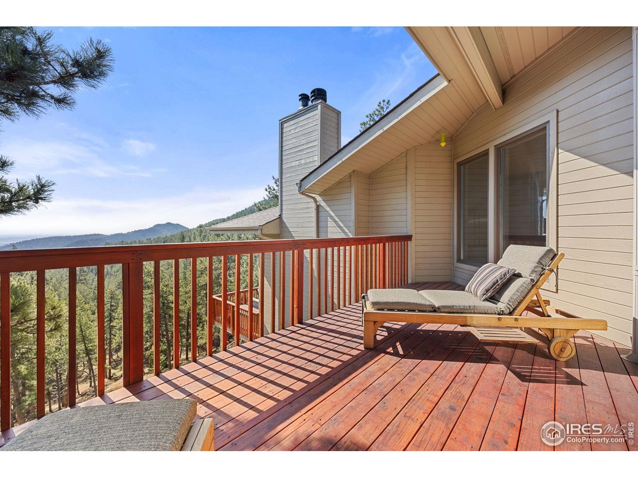 524 Cutter Lane Boulder, CO 80302 - Photo 22 of 49 a roof deck with wooden floor and fence