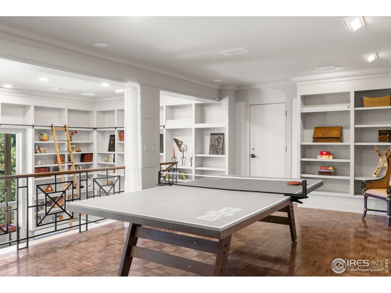 524 Cutter Lane Boulder, CO 80302 - Photo 32 of 49 a living room with furniture a table and bookshelf