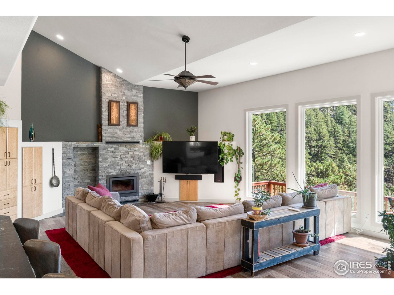 524 Cutter Lane Boulder, CO 80302 - Photo 9 of 49 a living room with fireplace furniture and a flat screen tv