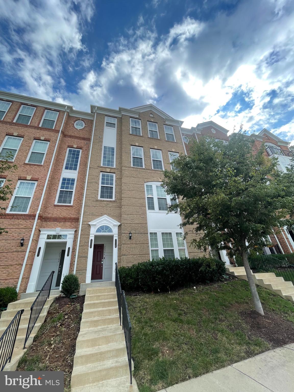 20586 Maitland Terrace Ashburn, VA 20147 - Photo 1 of 18 a front view of a house with a yard