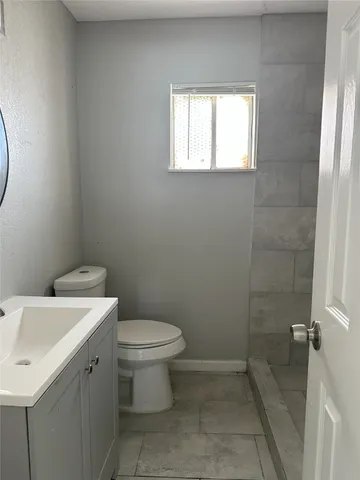 a bathroom with a sink and a toilet