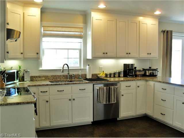 2457 Fairview Farm Road Asheboro, NC 27205 - Photo 4 of 15 Kitchen. The Lady of the house will enjoy this kitchen with custom cabinets, granite counter tops, high in stainless appliances to remain, recessed lighting, under cabinet lighting and gorgeous flooring.
