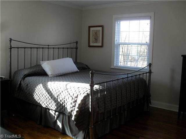 2457 Fairview Farm Road Asheboro, NC 27205 - Photo 7 of 15 Master Bedroom. Master Bedroom with beautiful hardwood flooring, crown molding and trim work and closet.
