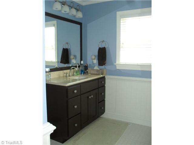 2457 Fairview Farm Road Asheboro, NC 27205 - Photo 9 of 15 Bath. Hall Bath with custom cabinet, tub w/shower and large storage /linen closet.