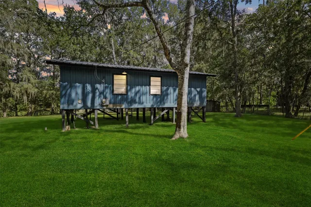 a backyard of a house with lots of green space