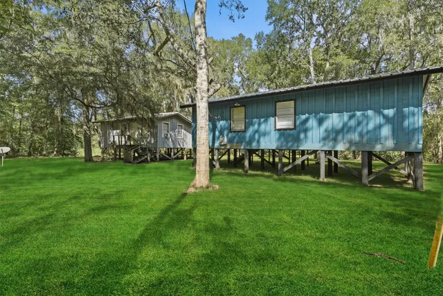 a backyard of a house with lots of green space