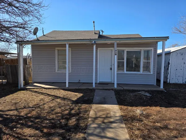 a front view of a house with yard