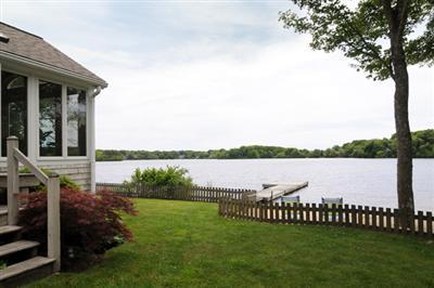 27 Nyes Point Way Centerville, MA 02632 - Photo 3 of 11 a view of a lake from a yard