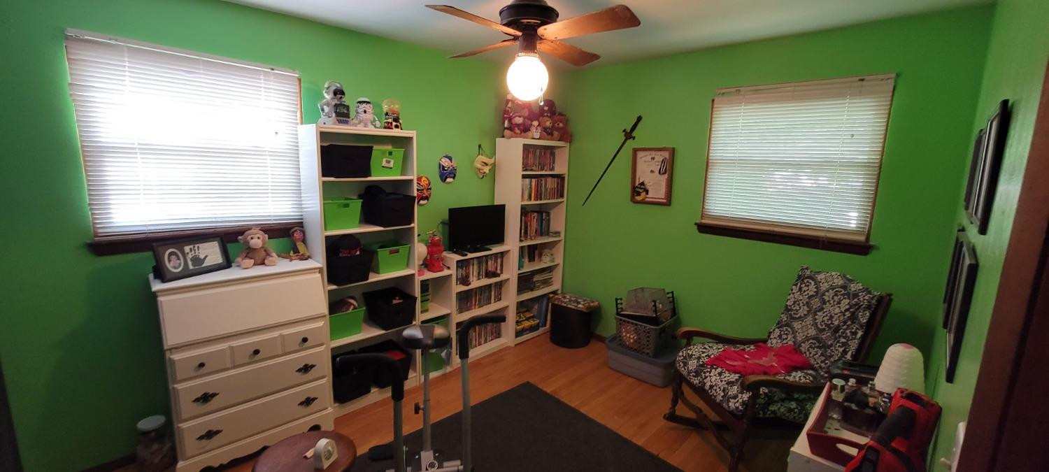 3402 North Wozniak Road Michigan City, IN 46360 - Photo 11 of 24 a bedroom with a bed and a window