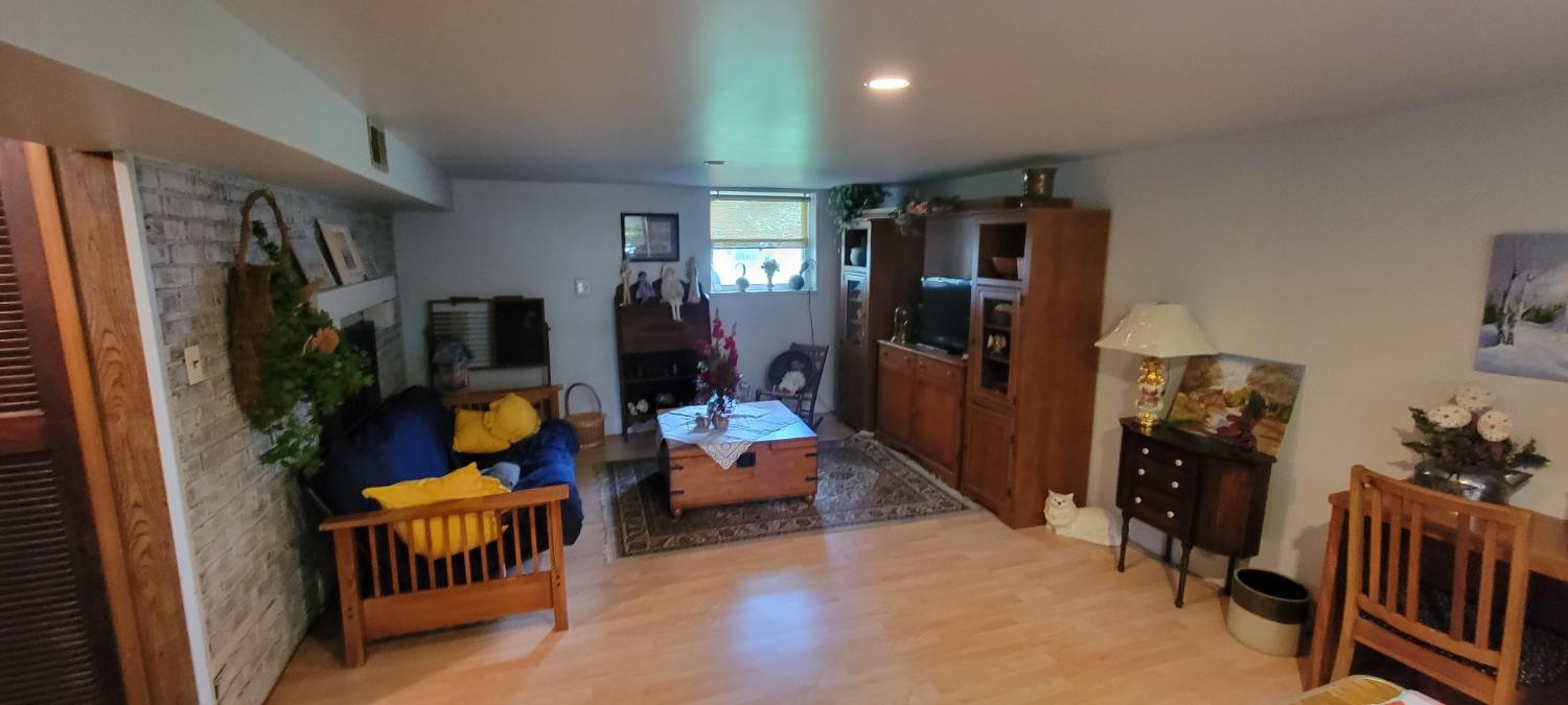 3402 North Wozniak Road Michigan City, IN 46360 - Photo 13 of 24 a living room with furniture and a flat screen tv