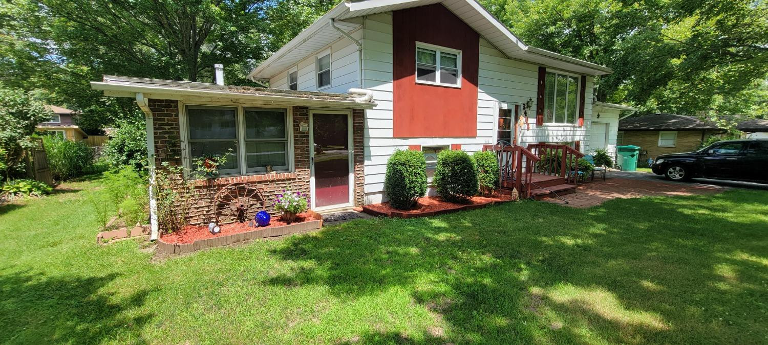 3402 North Wozniak Road Michigan City, IN 46360 - Photo 2 of 24 a front view of house with yard and green space