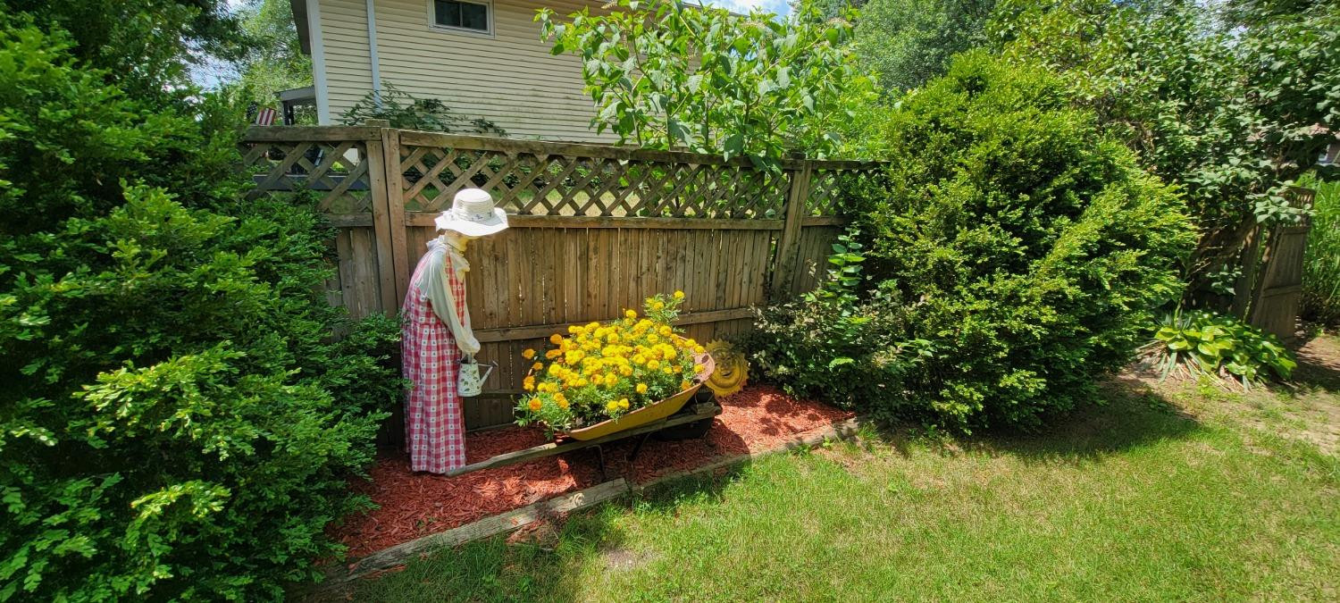 3402 North Wozniak Road Michigan City, IN 46360 - Photo 21 of 24 a garden view with a sitting space