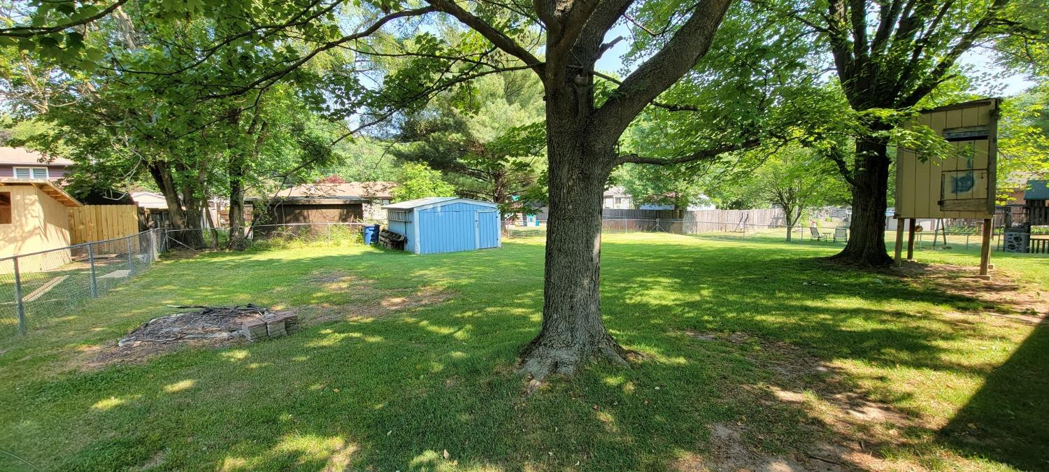3402 North Wozniak Road Michigan City, IN 46360 - Photo 22 of 24 a view of a garden with a tree