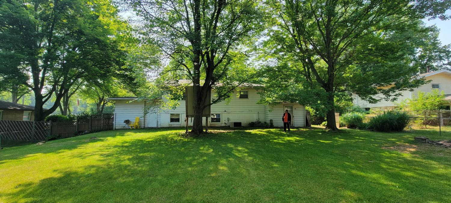 3402 North Wozniak Road Michigan City, IN 46360 - Photo 23 of 24 a view of a tree in front of a house