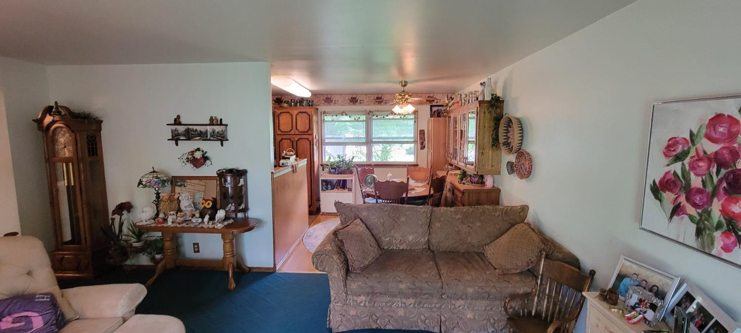 3402 North Wozniak Road Michigan City, IN 46360 - Photo 3 of 24 a living room with furniture and a large window