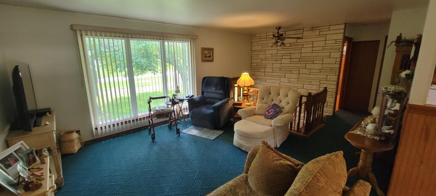 3402 North Wozniak Road Michigan City, IN 46360 - Photo 4 of 24 a living room with furniture and a flat screen tv
