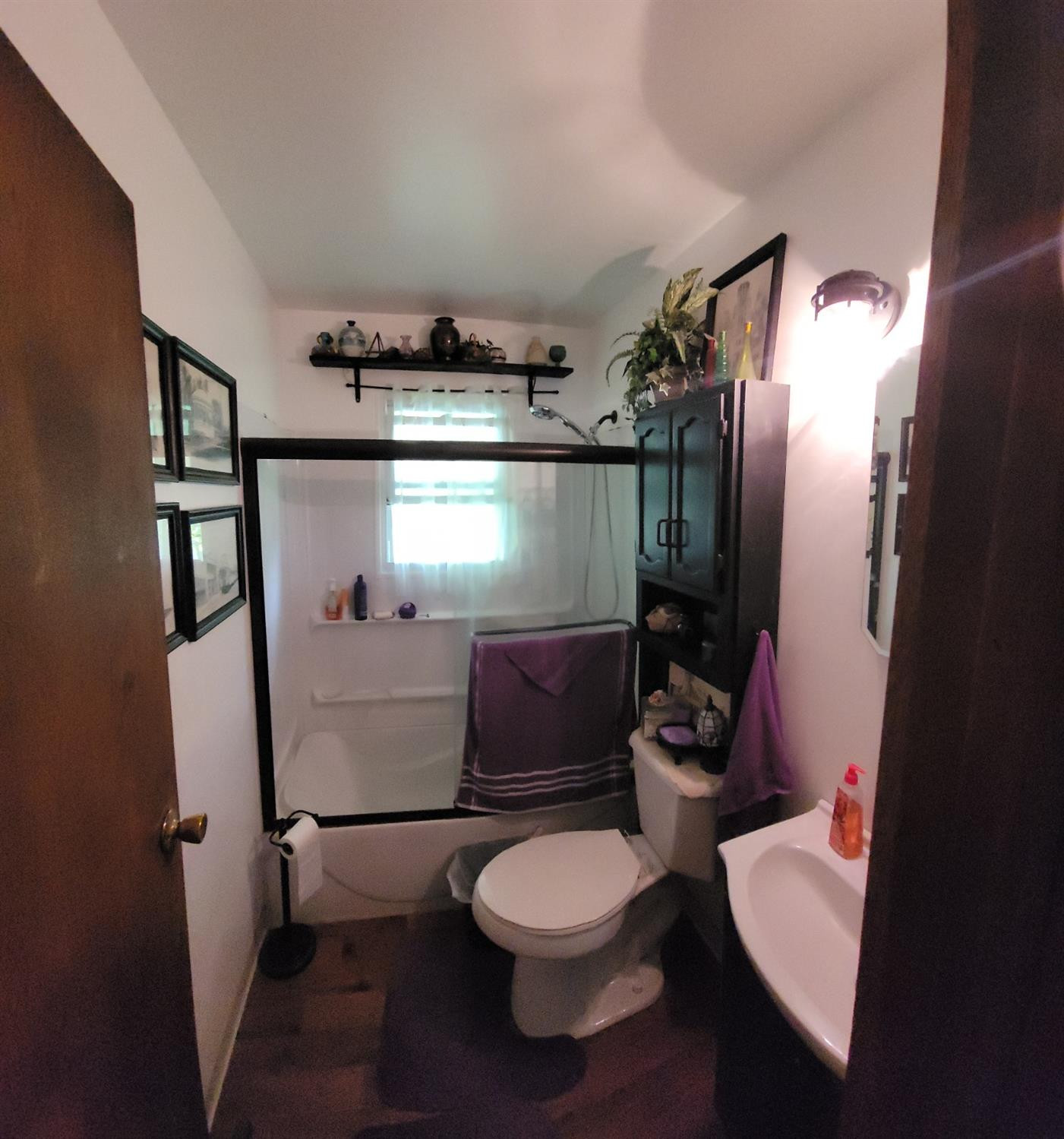 3402 North Wozniak Road Michigan City, IN 46360 - Photo 9 of 24 a bathroom with a toilet a sink and mirror