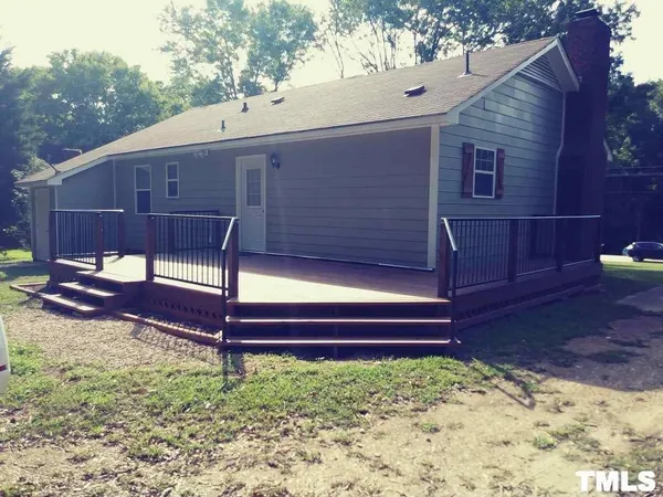 a view of a backyard with a sitting area