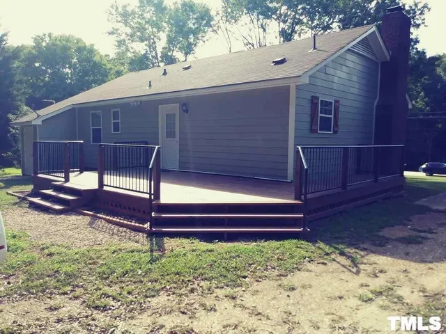 a view of a backyard with a sitting area